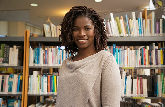 a librarian smiling while at work