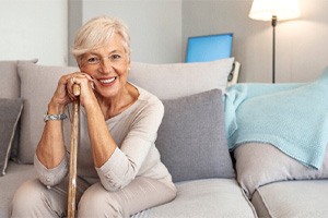 a woman smiling with dentures in St. Augustine 