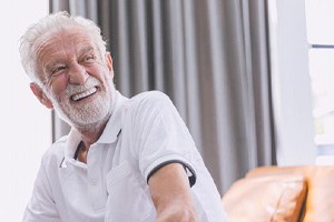 Man with dentures laughing