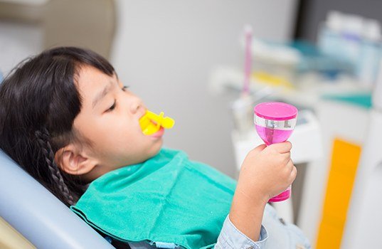 Child receiving fluoride treatment