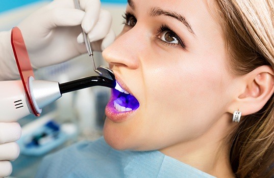 Patient receiving cosmetic dental bonding treatment