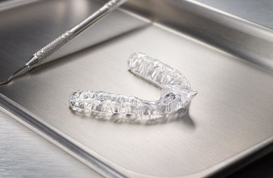 Clear nightguard for bruxism on metal tray