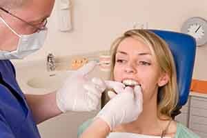 Patient in St. Augustine talking to dentist about Invisalign