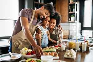 Invisalign Patient in St. Augustine smiling with family