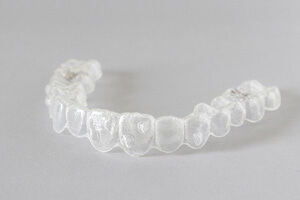 clear aligner lying on gray surface