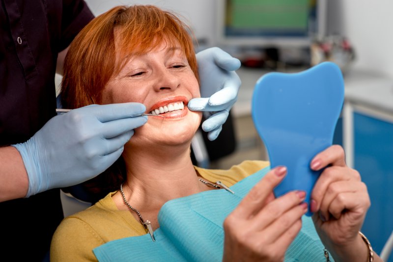 patient smiling with dentures in St. Augustine