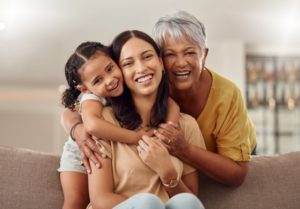 two generations of mothers with healthy and beautiful smiles