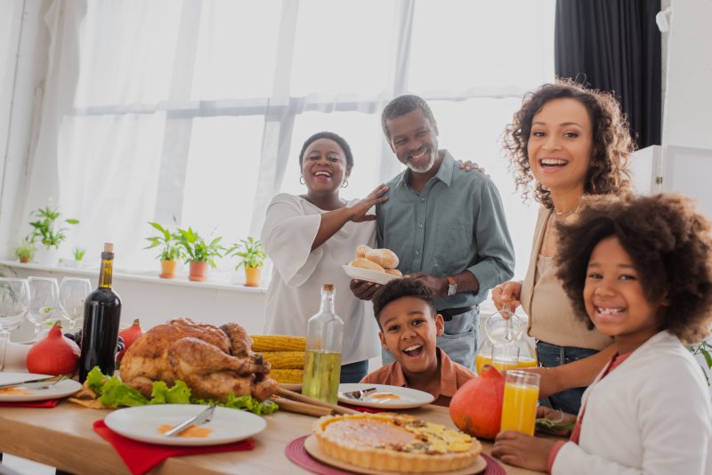 A family enjoying Thanksgiving while appreciating their saliva