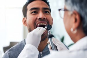 Man being examined by dentist. 