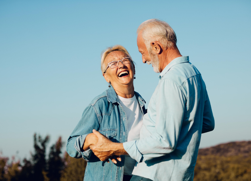 Senior couple smiling and dancing
